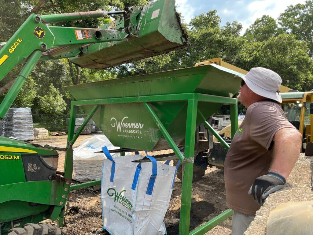 Filling a Woerner SuperSack with bulk soil