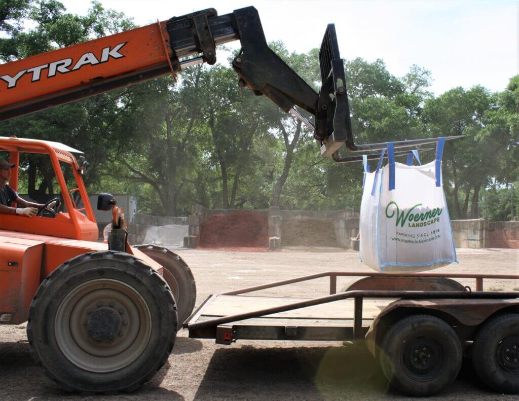 Loading a Woerner SuperSack onto a trailer